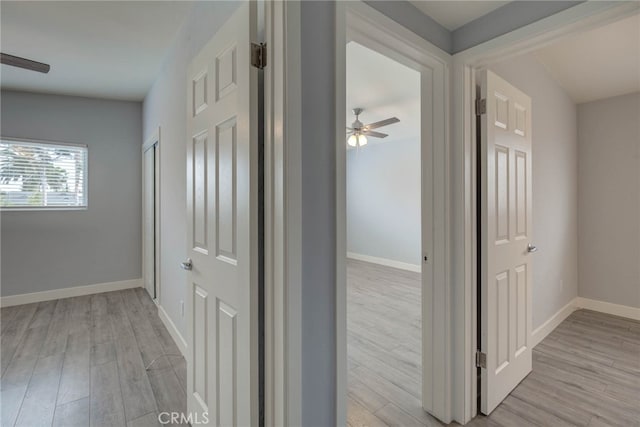 corridor featuring light hardwood / wood-style floors