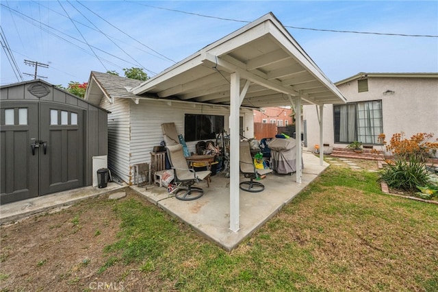 view of patio / terrace with a storage unit