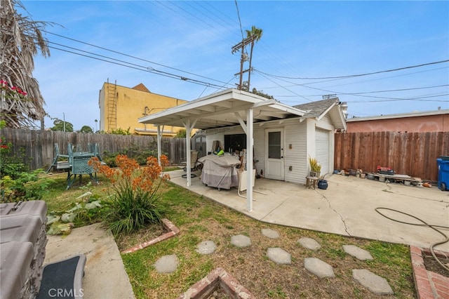 back of property with a patio