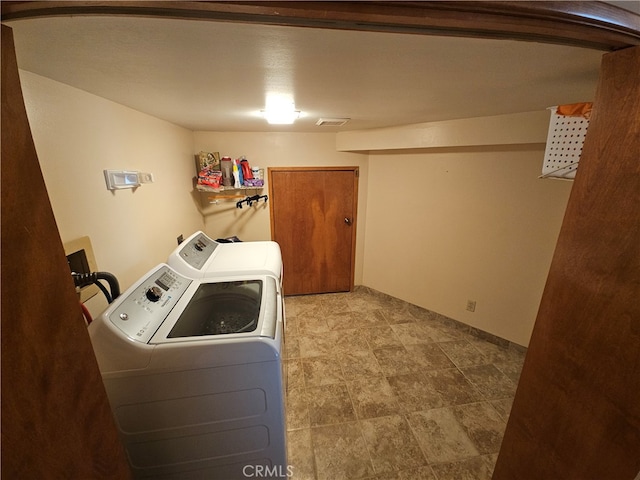 washroom featuring washing machine and dryer