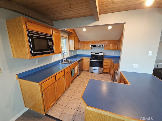 kitchen with vaulted ceiling with beams, appliances with stainless steel finishes, wood ceiling, and range hood