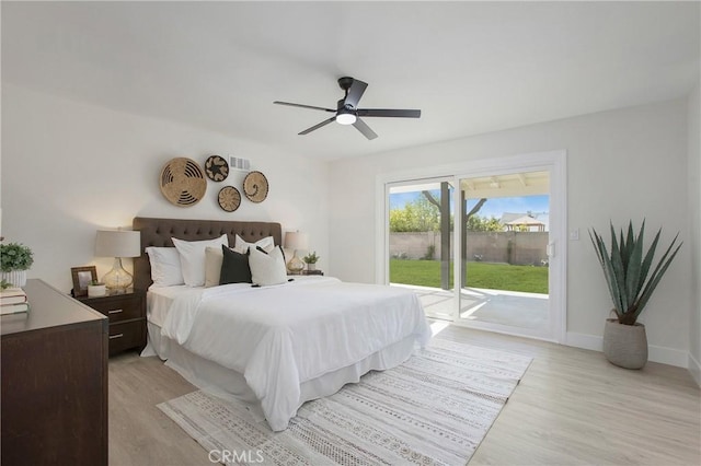 bedroom with access to exterior, light hardwood / wood-style flooring, and ceiling fan