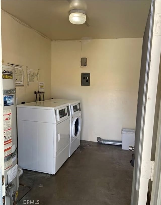 washroom featuring washer and clothes dryer, water heater, and electric panel