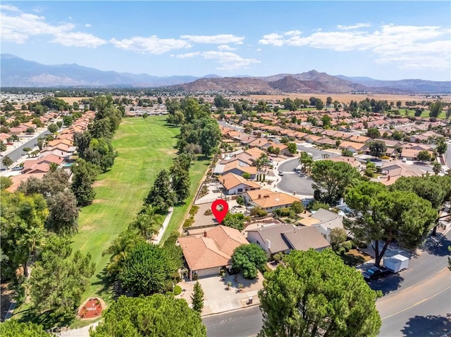 birds eye view of property featuring a mountain view