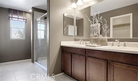 bathroom with vanity, tile patterned floors, and an enclosed shower