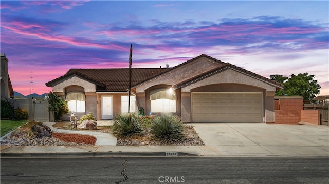 ranch-style home with a garage