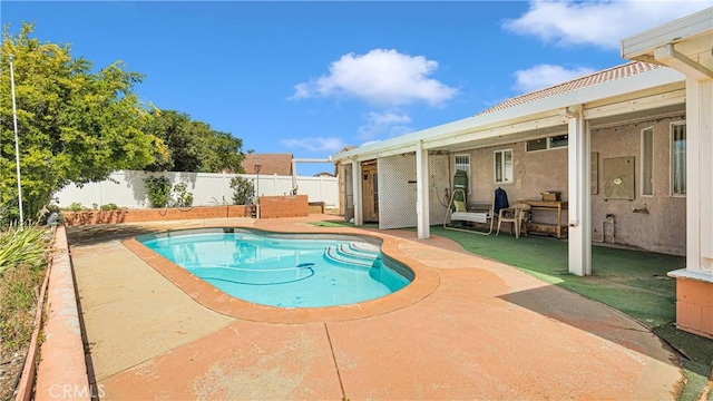 view of pool featuring a patio area, a fenced in pool, and a fenced backyard