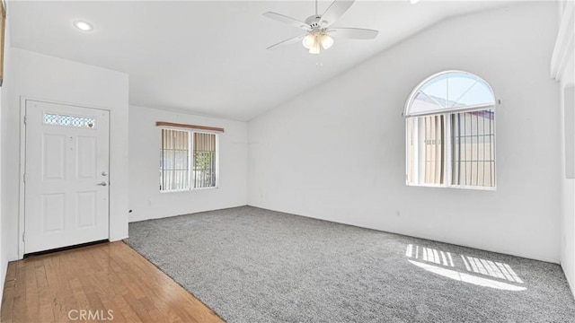 interior space with vaulted ceiling, carpet flooring, recessed lighting, and a ceiling fan