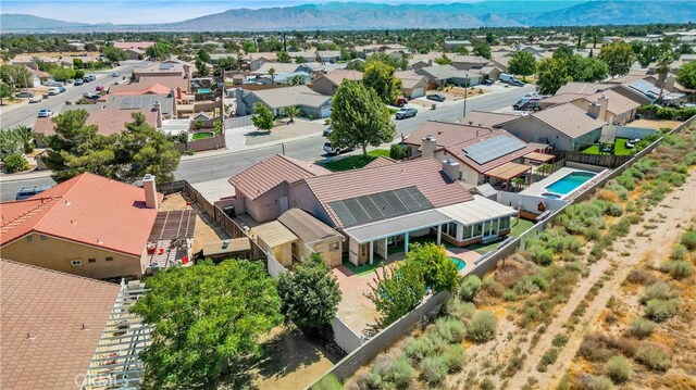 birds eye view of property with a mountain view