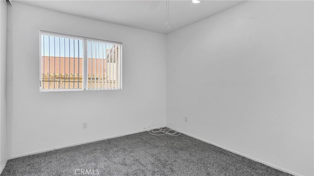 carpeted spare room with baseboards and recessed lighting