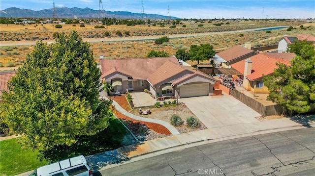 birds eye view of property featuring a mountain view and a rural view