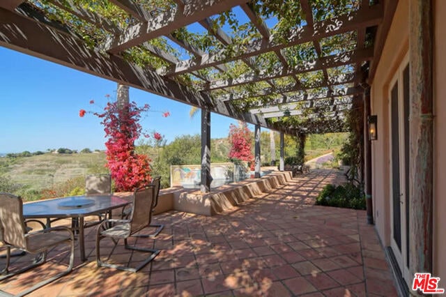 view of patio / terrace featuring a pergola