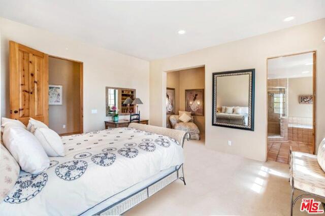 bedroom with light colored carpet