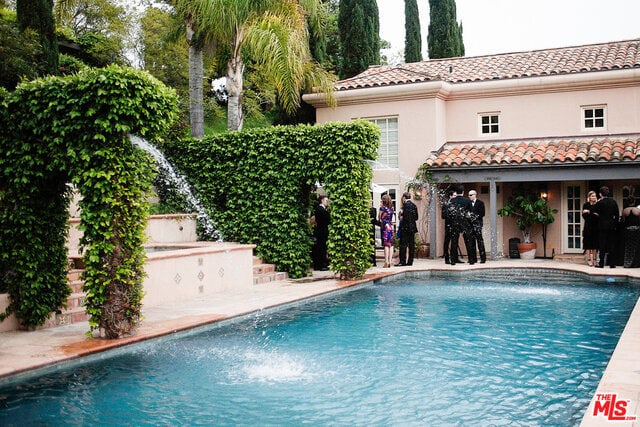 view of swimming pool featuring an outdoor structure