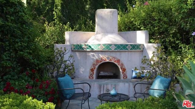 view of patio featuring an outdoor fireplace