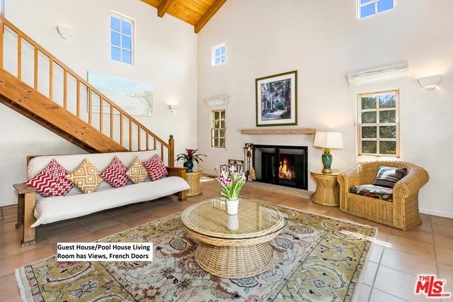 tiled living room with beam ceiling, wood ceiling, and high vaulted ceiling