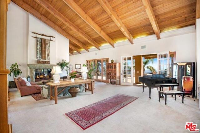 living room featuring beamed ceiling, wood ceiling, high vaulted ceiling, and french doors