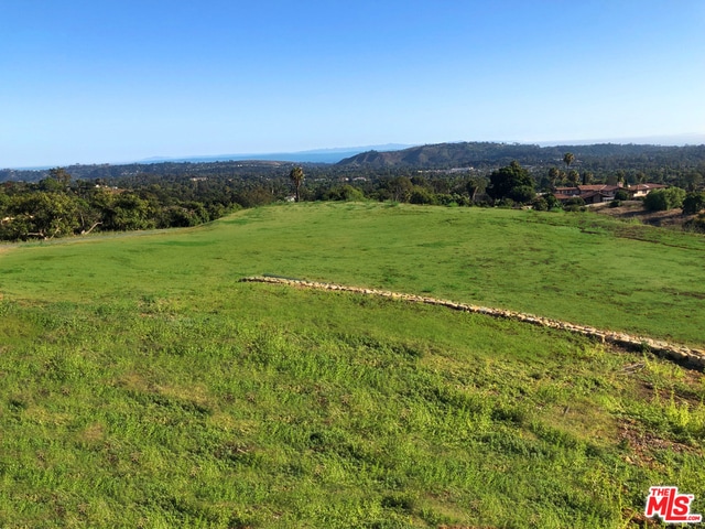 exterior space featuring a rural view and a mountain view