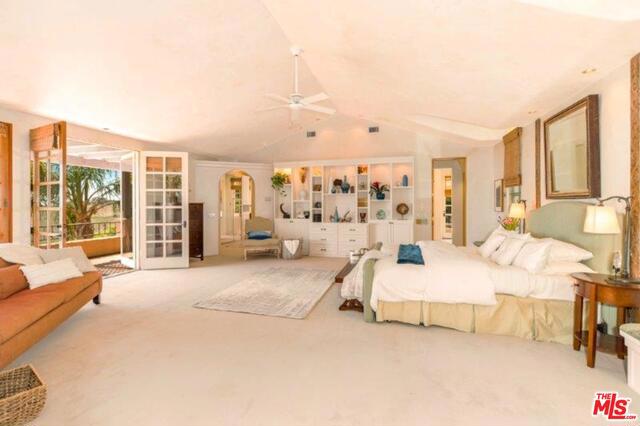 bedroom with lofted ceiling, ceiling fan, light carpet, access to outside, and french doors