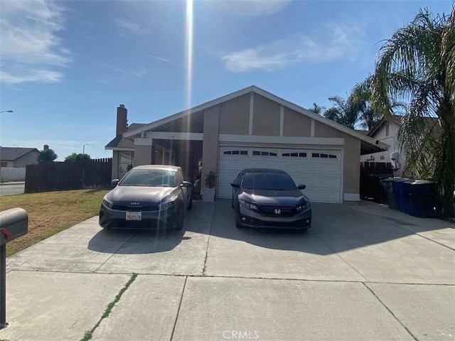 single story home with a front yard and a garage