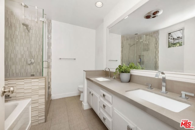 full bathroom with plus walk in shower, tile patterned flooring, vanity, and toilet