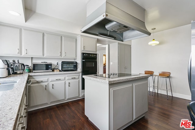 kitchen featuring pendant lighting, white cabinets, island range hood, black appliances, and dark hardwood / wood-style floors