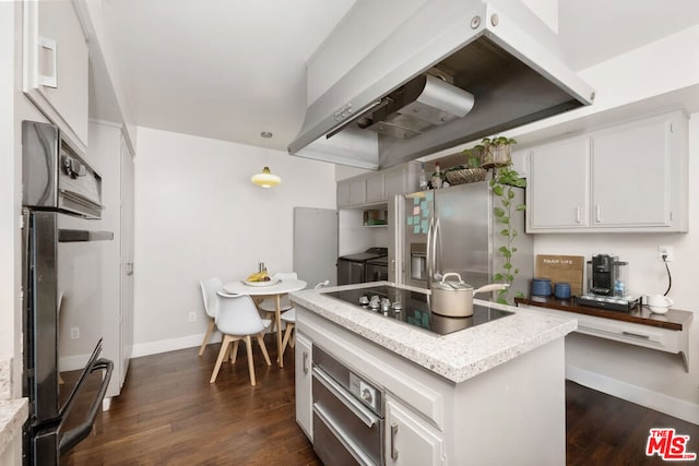 kitchen featuring white cabinets, decorative light fixtures, dark wood-type flooring, extractor fan, and black appliances