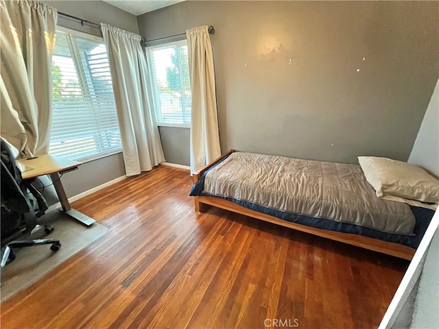 bedroom with wood-type flooring