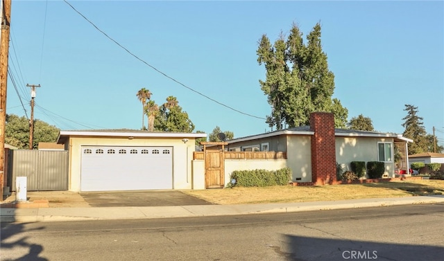 ranch-style house featuring a garage