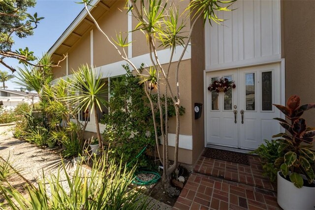 doorway to property featuring french doors