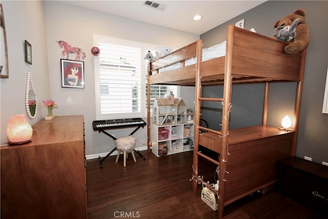 bedroom featuring dark hardwood / wood-style floors