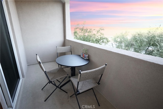 view of balcony at dusk