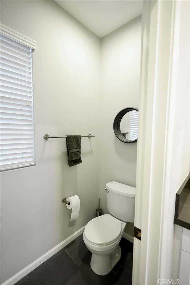 bathroom featuring toilet and tile patterned floors