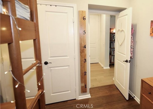 hallway featuring dark hardwood / wood-style floors