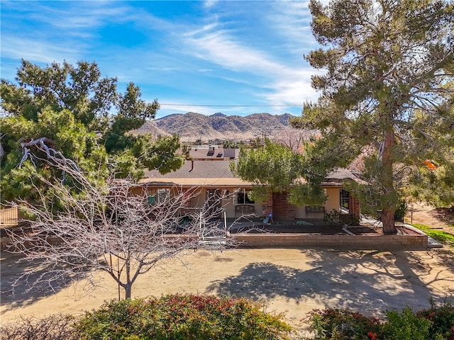 rear view of house with a mountain view