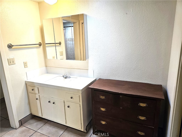 bathroom featuring vanity and tile patterned flooring