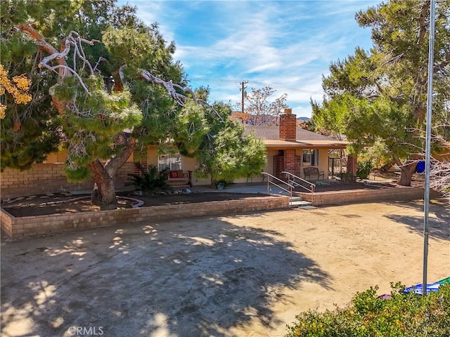 view of front of home with a chimney