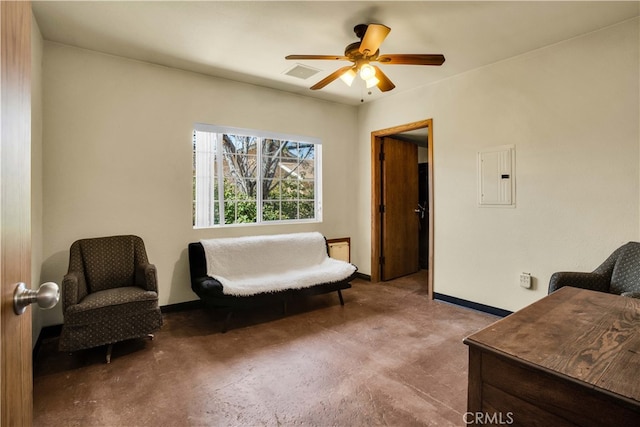 sitting room with carpet flooring, electric panel, and ceiling fan