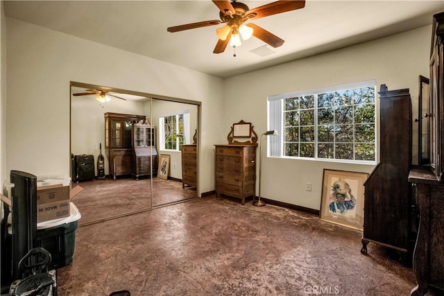 interior space with a wealth of natural light and ceiling fan