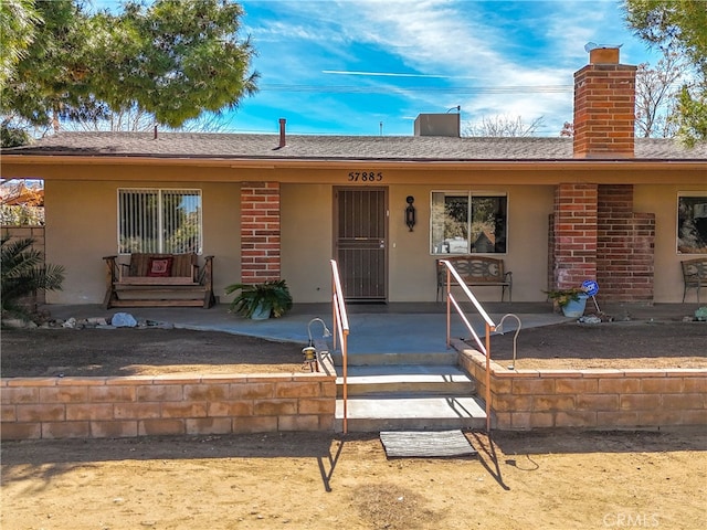 single story home with covered porch