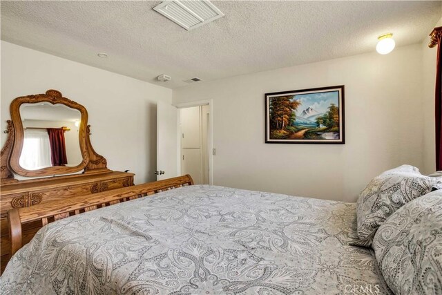 bedroom featuring a textured ceiling