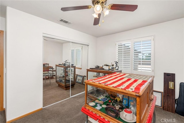 dining room featuring carpet, visible vents, ceiling fan, and baseboards