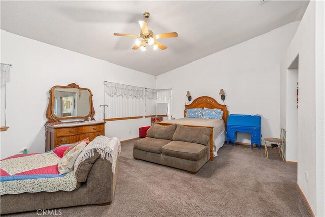 bedroom featuring vaulted ceiling, ceiling fan, and light colored carpet