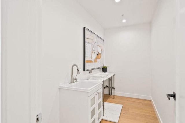 interior space featuring hardwood / wood-style flooring and sink