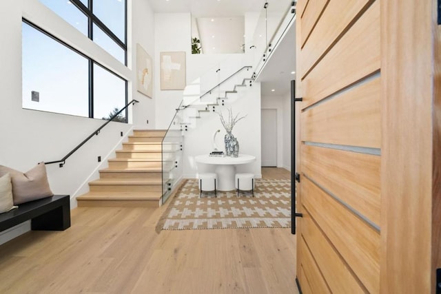 stairs with hardwood / wood-style flooring