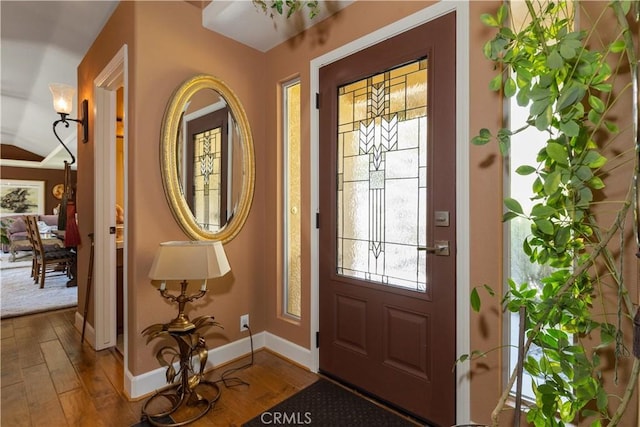 entryway with hardwood / wood-style floors