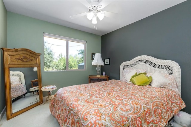 bedroom featuring ceiling fan and light colored carpet