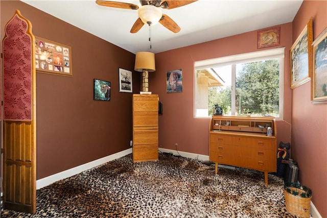 interior space featuring ceiling fan