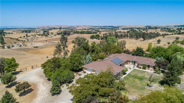 birds eye view of property with a rural view