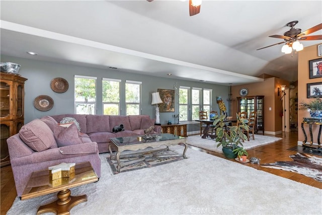 living room with ceiling fan and wood-type flooring